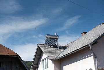 Solar water heat pipe collector on the  roof, Solar panel with 15 vacuum tubes for domestic hot water preparation with non-pressurized stainless steel tank