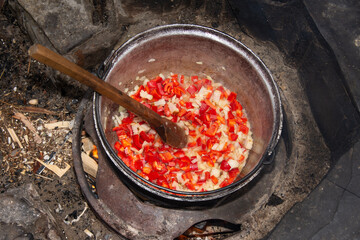 finely chopped red onion and sweet bell pepper ready for the cauldron, specialty from Romania