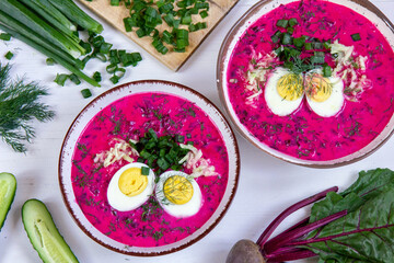 Cold beet soup - traditional cold beetroot soup with yogurt, egg, dill, chives and cucumber. A vegetarian summer dish