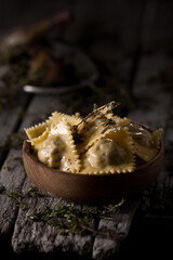 Dumplings on wooden plates, on a dark background, food photography.