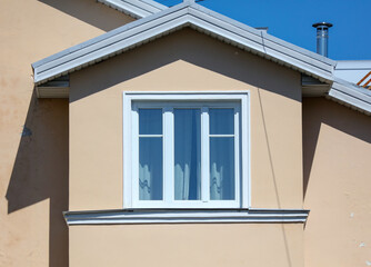 Window in the wall of the house.