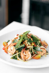 thai spicy papaya salad with fresh prawns and basil
