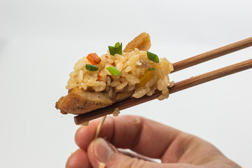 Rice with vegetables on sticks on a white background. food photography