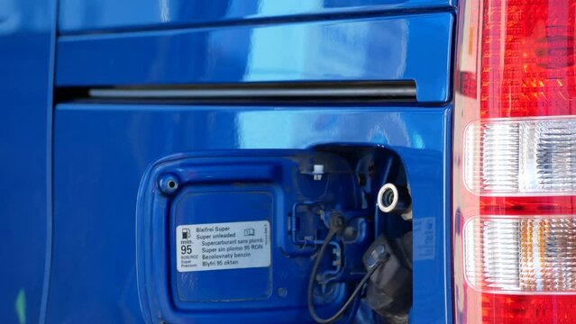 Compressed natural gas (CNG) vehicle fuel nozzle connected to car