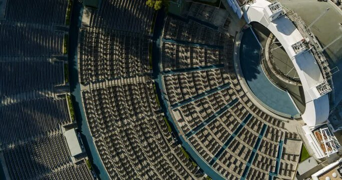 Aerial Spinning And Reversing Away From An Empty Hollywood Bowl Amphitheatre In The Hollywood Hills On A Bright Sunny Day - Los Angeles, California