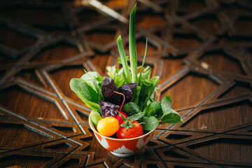 Vegetables and greens, on a dark background, food photography.