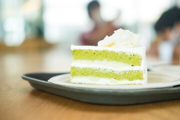 Sliced green tea mix with coconut cake