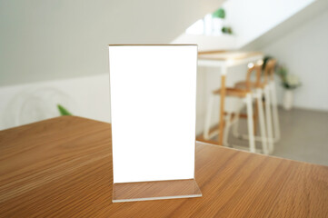 Wenu frame standing on wood table in  Bar restaurant cafe. Space for text marketing promotion.  © Wanda