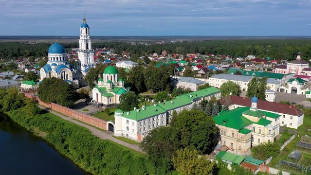 Tilt down aerial shot of Uspenskaya Tikhonova Pustyn Monastery on sunny summer day. Leo Tolstoy village, Kaluga Oblast, Russia.