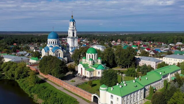 Orbital aerial shot of Uspenskaya Tikhonova Pustyn Monastery on sunny summer day. Leo Tolstoy village, Kaluga Oblast, Russia.