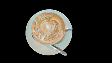 Hot latte coffee on black background.