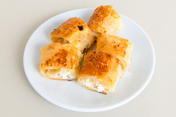 Turkish style meat stuffed filo dough borek served kol boregi. Cheese and minced pie are sliced on...