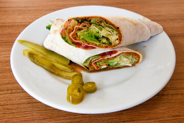 Traditional Turkish Raw Meat Wrap ( Turkish Name : Cig Kofte Durum ). Raw Meat in roll of bread lavash. Turkish food. 