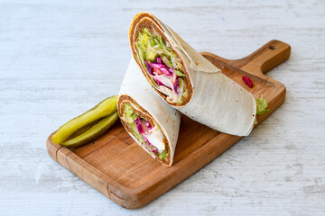 Traditional Turkish Raw Meat Wrap ( Turkish Name : Cig Kofte Durum ). Raw Meat in roll of bread...