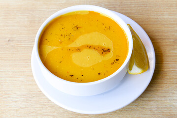 Lentil ( mercimek ) soup with melted butter and red pepper sauce