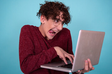 A man watches an adult video online.	