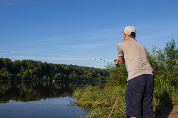 man fishing on the lake