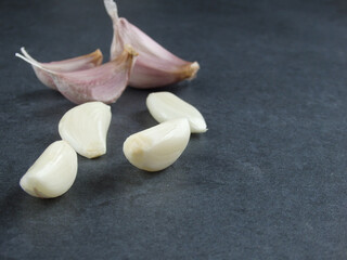 Natural product onion and garlic on grey stone table. garlic on a gray background