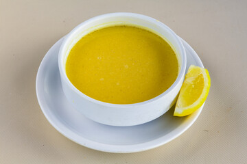 Lentil ( mercimek ) soup with melted butter and red pepper sauce
