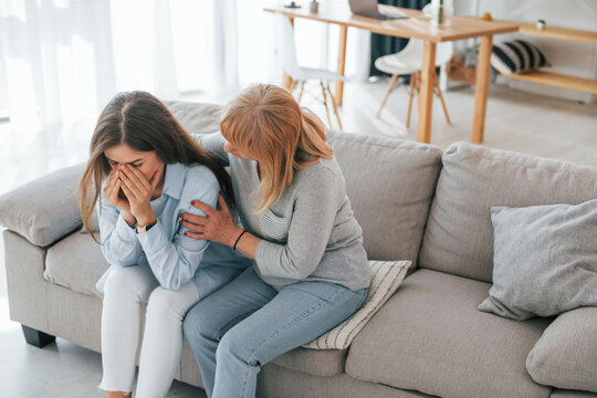 Woman supports her daughter. Mother and woman is together at home