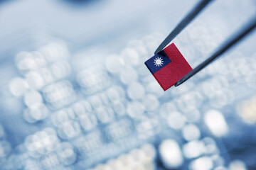 Flag of the Republic of China or Taiwan on a processor, CPU Central processing Unit or GPU microchip on a motherboard. Taiwan manufacturing chip industry emerges as battlefront in US - China showdown.
