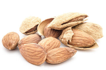 Almonds and almond shells on white background