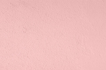 Saturated pastel light pink colored low contrast Concrete textured background. Empty colourful wall texture with copy space for text overlay and mockups. 2023, 2024 color trend