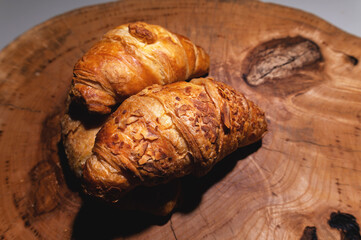 Two Croissant on a wooden tray, close-up