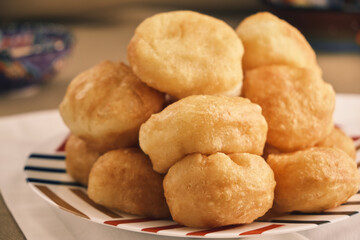 Freshly baked Boortsog (baursak) Traditional Kazakh Asian food in the sunrise at Kazakh home