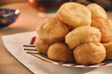 Freshly baked Boortsog (baursak) Traditional Kazakh Asian food in the sunrise at Kazakh home