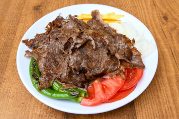 Turkish and Arabic Traditional Ramadan doner kebab with tasty tomato sauce and rice or turkish...