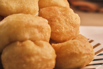 Close up of a lot of freshly baked Boortsog (baursak) traditional food of kazakh in the sunrise at home