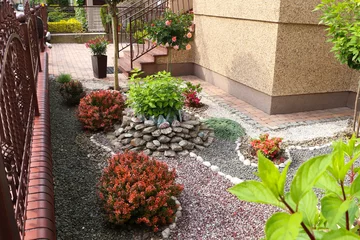 Foto op Canvas Beautiful gravel garden with different plants in yard © New Africa