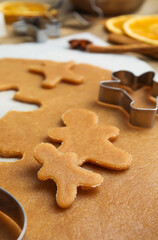 Dough and cookie cutter on table, closeup