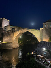 old arched pedestrian bridge in Mostar Bosnia Europe at night