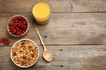 Flat lay composition with muesli on wooden table, space for text. Delicious breakfast