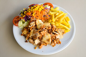 Turkish and Arabic Traditional Ramadan chicken doner kebab with tasty tomato sauce and rice or...