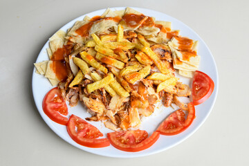 Turkish and Arabic Traditional Ramadan chicken doner kebab with tasty tomato sauce and rice or...