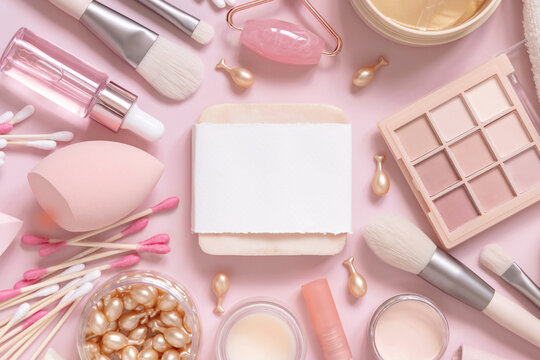 Soap bar with blanik label, skin care and decorative cosmetics on pink, top view, mockup
