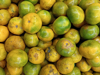 fresh juicy orange green fruit in food market