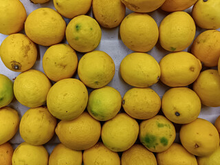 fresh ripe yellow lemon fruit tasty in food market