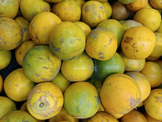 fresh juicy orange green fruit in food market