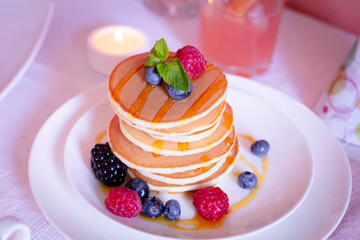 Pancakes with berries, morning breakfast, selective focus