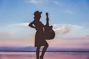 Photo of happy woman with acoustic guitar overjoyed isolated vibrant blue sunset color background