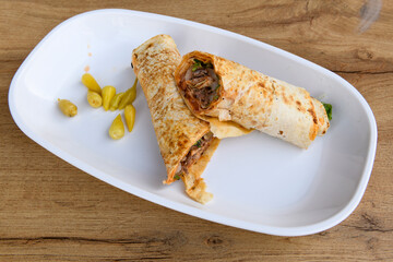 Lavash doner kebab ( doner zurna durum )  or shawarma sliced in plate isolated. 