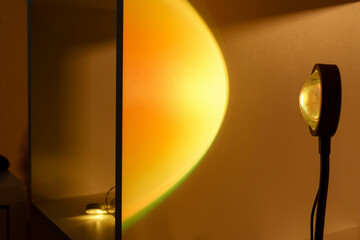 Sunset projector lamp. Multi colored RGB light. Home decor, interior. Selective focus
