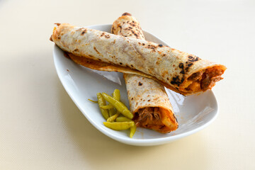 Lavash doner kebab ( doner zurna durum )  or shawarma sliced in plate isolated. 