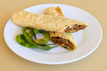 Lavash doner kebab ( doner zurna durum )  or shawarma sliced in plate isolated. 