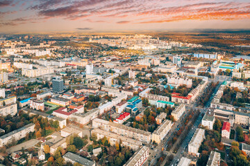 Fototapeta na wymiar Aerial view of Homiel cityscape skyline in autumn day. Dramatic sky over residential district. Bird's-eye view of Gomel, Belarus.