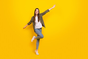 Fototapeta na wymiar Full size photo of cheerful good mood female have fun dancing feel freedom isolated on yellow color background